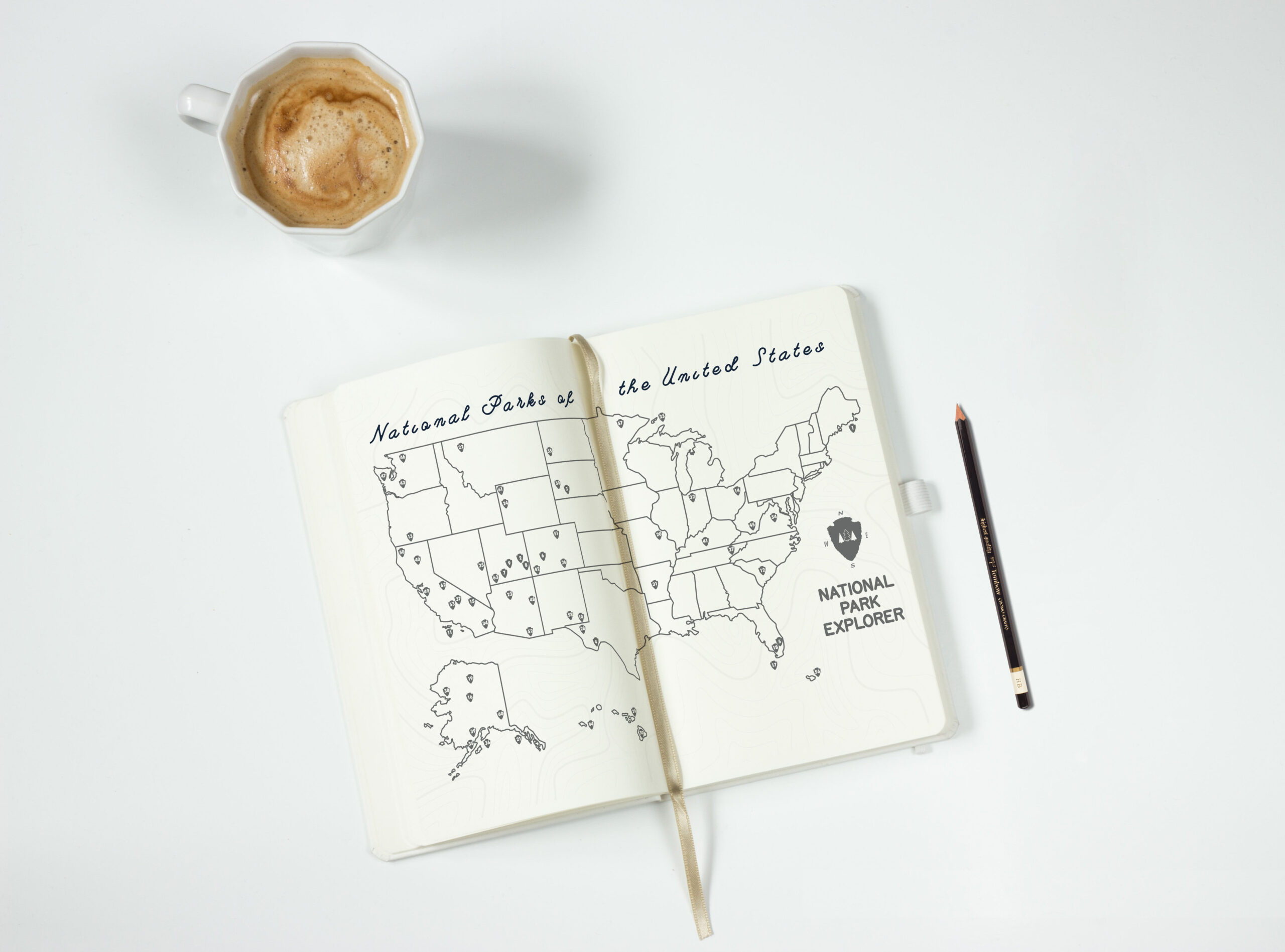 A book open to a two page spread featuring a map of the US showing national park locations