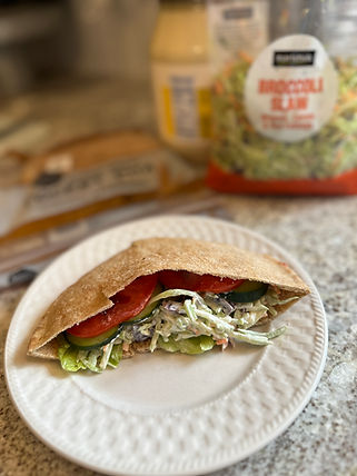 Half of an open veggie pita on a plate