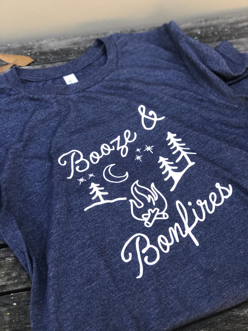 Blue T-shirt with the words Booze and Bonfires and a campfire graphic