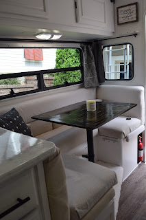 Image of the dinette area inside a truck camper