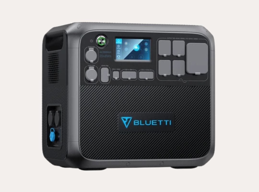 A black Bluetti Power Station with a blue logo and blue screen